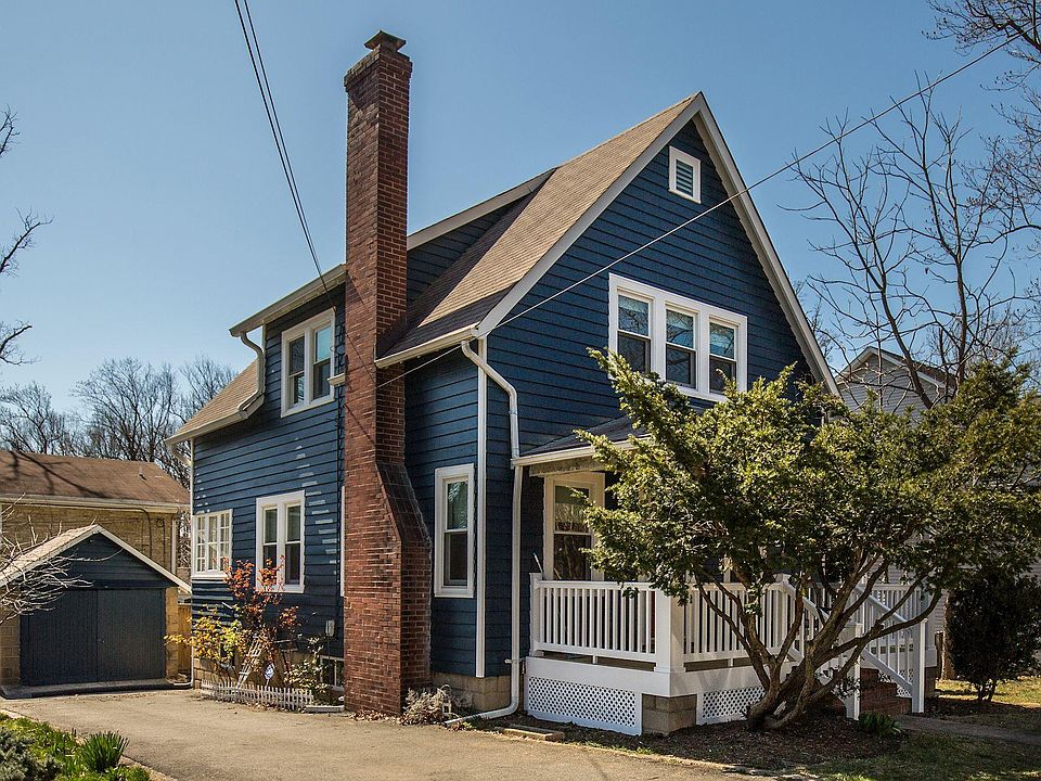 Charming Front Porch and long driveway with lots of parking!