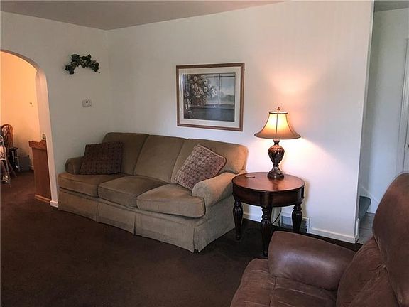 living room which flows into the formal dining room.