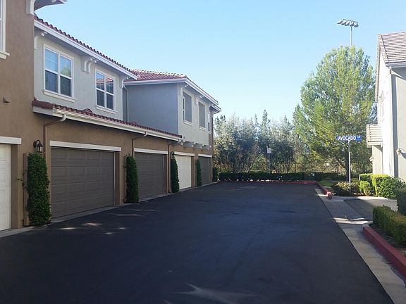 The garage is on the end left next to the paseo.