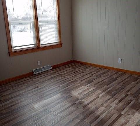 Dining room with new paint and luxury plank floor.