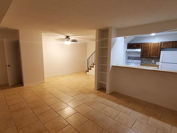 Living room, dining area, and kitchen.