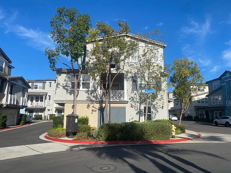 Side view of Condo with pool directly behind