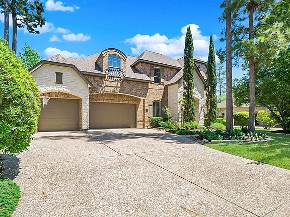 Brick & stone exterior highlight this classic beauty in Player Woods!