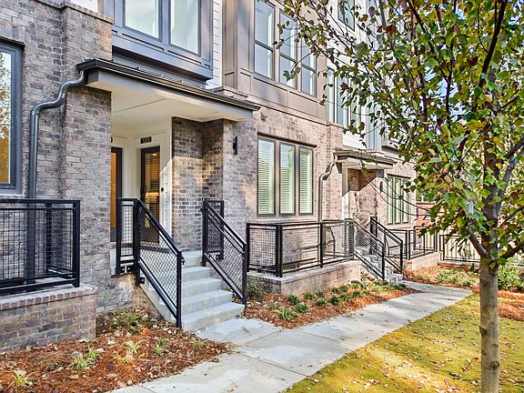 Beautiful Brick "Stack" unit with shared front porch and fronting private green space with views of Beltline Trail.