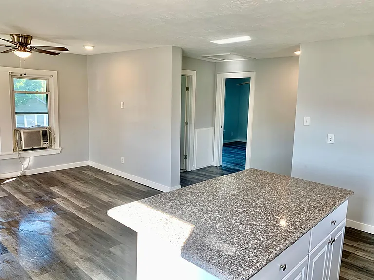 Open Concept Living Room with recess lighting.