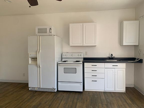 Kitchenette wit new countertops and hardware.