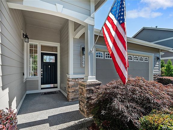 Covered entry with attractive stonework.
