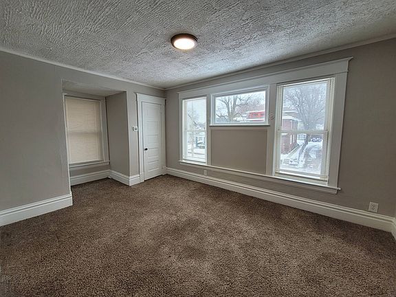 Living room with additional nook and storage closet