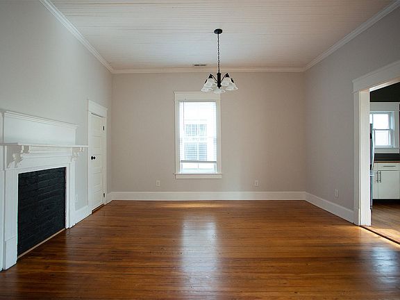 Dining room. Kitchen to the right, living room to the left, bedroom #2 behind camera.