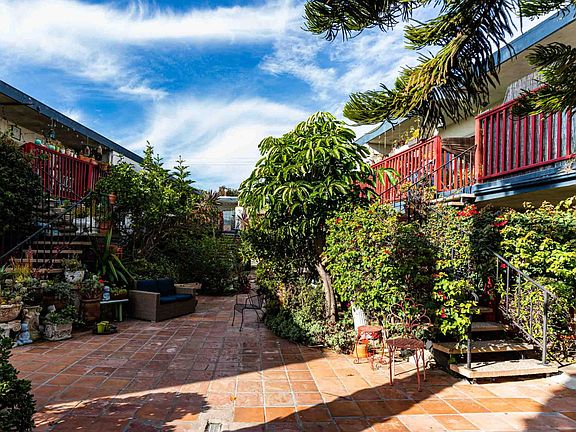 Peaceful courtyard and stairs to unit (on right)