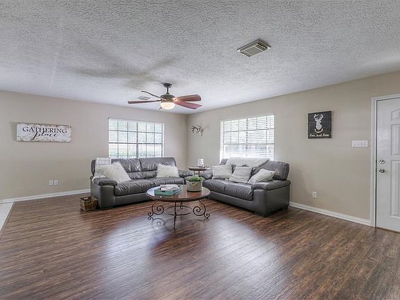 Natural light floods the living area during the day.