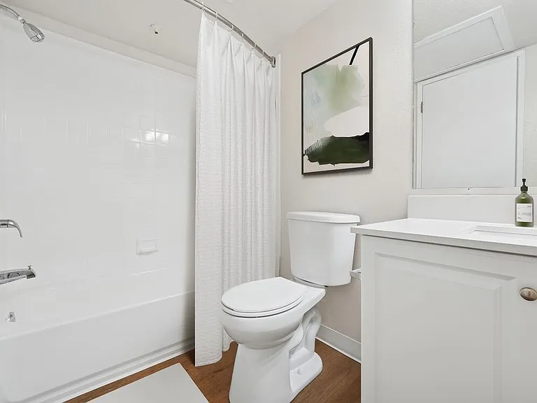 Renovated Package I bath with quartz countertop and hard surface flooring
