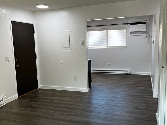 Living room, dining area and front door