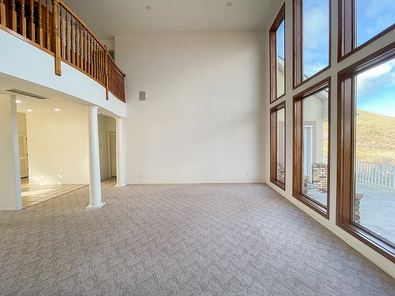 The beauty of nature comes right into the living room through the huge floor to ceiling windows.
