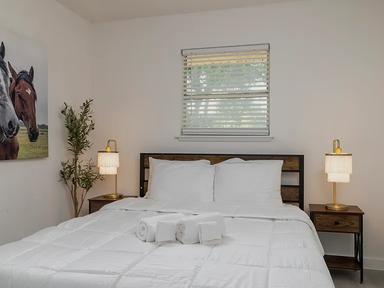 Bedroom #1 with attached full bath and queen bed.