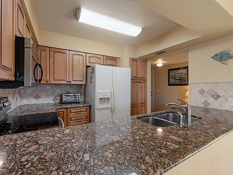 Enjoy the waterfront view while cooking from the well-equipped kitchen.