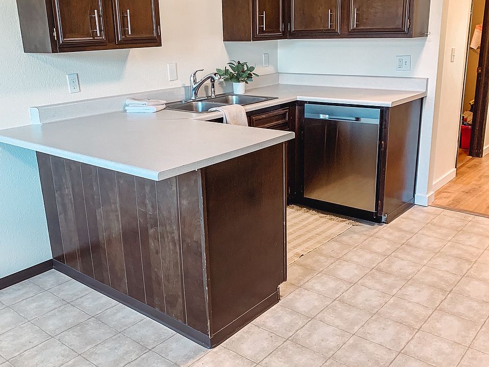 Good size kitchen with bar seating, dishwasher, range and fridge.