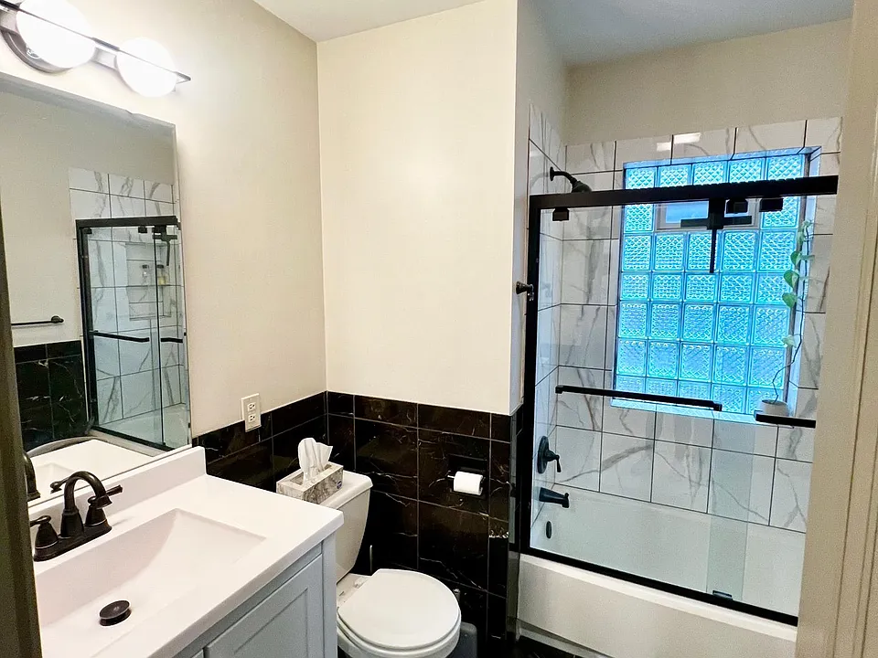 remodeled 2nd floor bath with matte black finishes and custom tile shower