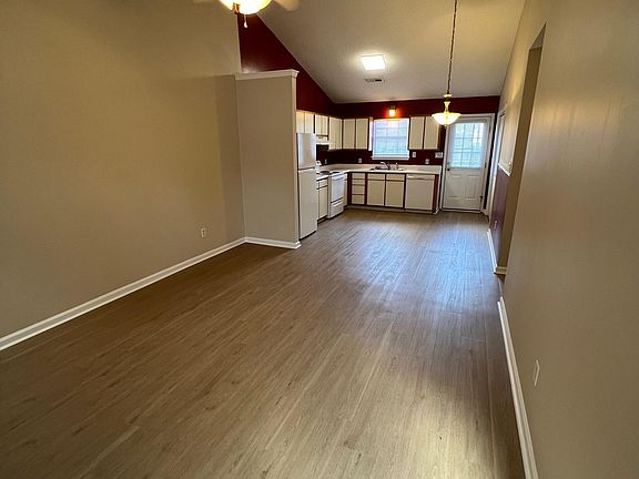 View from entry. Great room with vaulted ceiling.