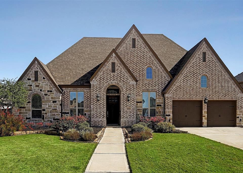 Home has beautiful custom stone and brick front with special mortar feature. Home is the same floor plan as the model home that was very popular in this section. It has a one of a kind front elevation that sets it apart. Upgraded up lights to show th