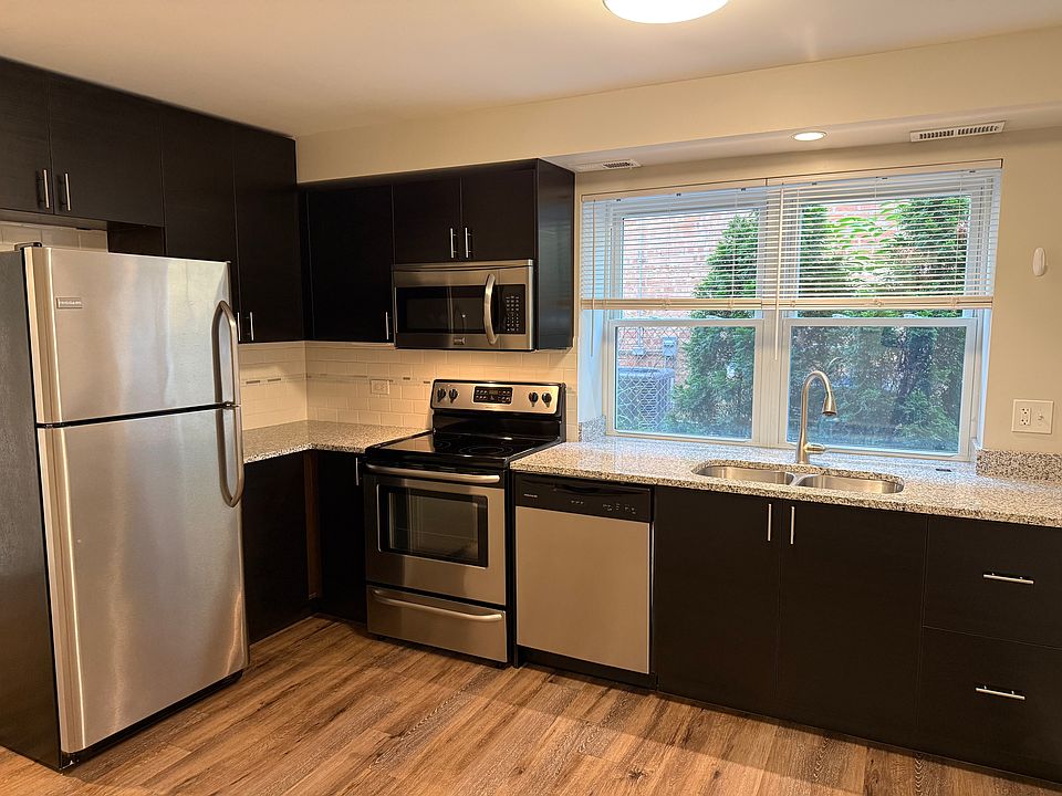 Kitchen with granite countertops and stainless steel appliances.