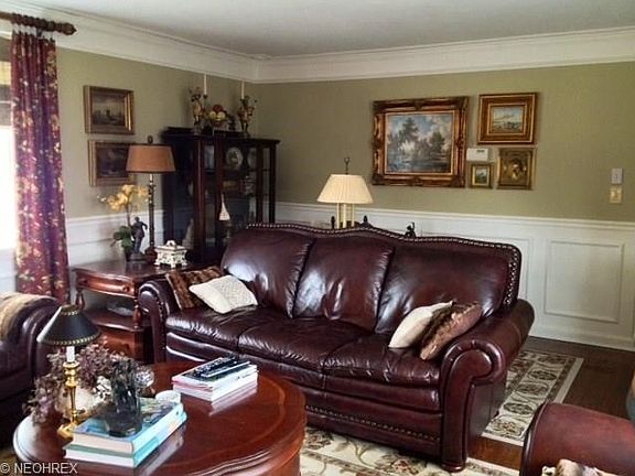 Refinished oak floors, elaborate crown molding and paneled lower walls all add to the formal elegance.