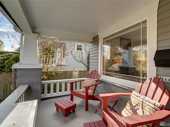 Relax and enjoy the neighborhood on the covered sitting porch. 