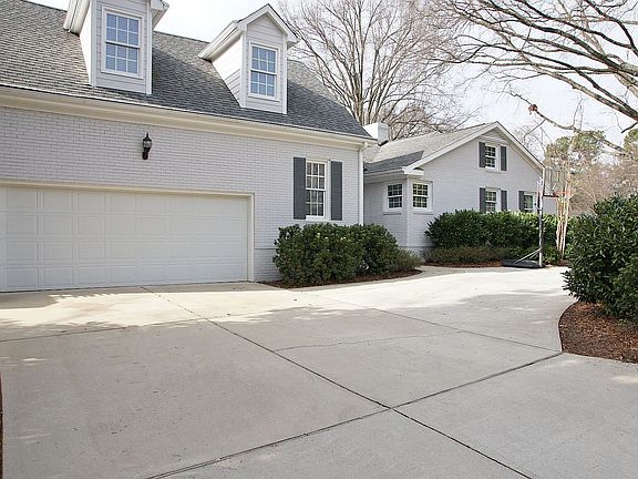 Side entry garage with circular driveway & side hall entrance