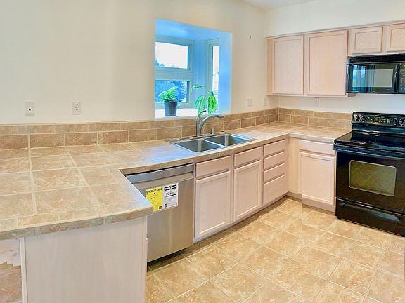 Electric range, microwave, stainless dishwasher