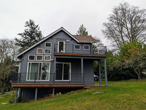 Back of house with two decks