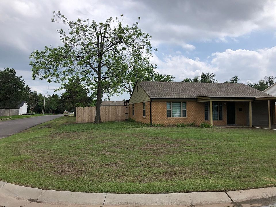 Large corner lot. Huge, cedar fenced back yard with RV Carport.