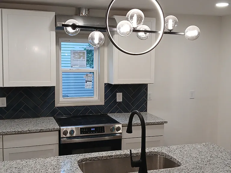Another view of kitchen looking towards front of home
