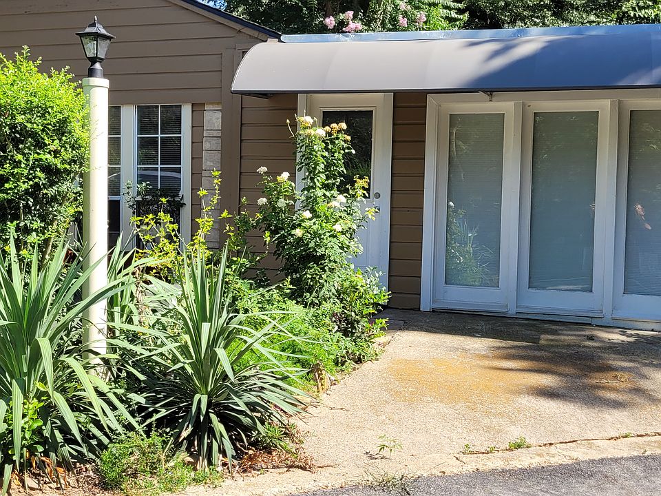 Front entry. Reserved parking right to the right.This side faces the north, so no direct sunlight in front windows. Front room usually used for a living room.