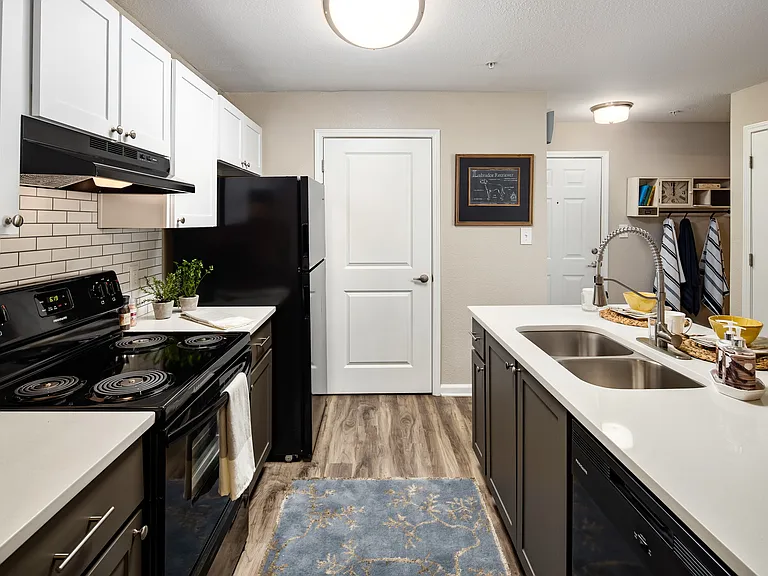 Kitchen with white shaker-style cabinets