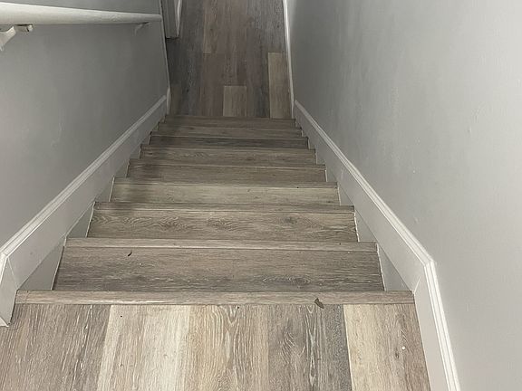 Foyer heading to living room, dining room, kitchen