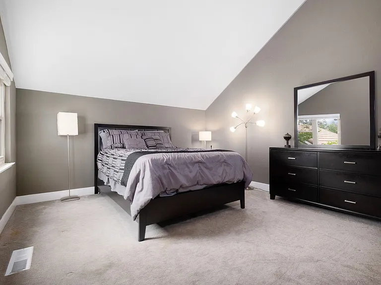 Upstairs Queen bedroom with Smart TV, Shutter blinds to blackout the room for sleep, and private bathroom & shower.