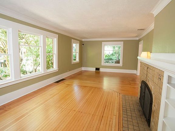 living room with gas fireplace, just repainted in neutral
