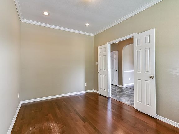 Formal Living Room, to the right of the Entry.. Crown moulding, recessed can lighting. 6 paneled doors.