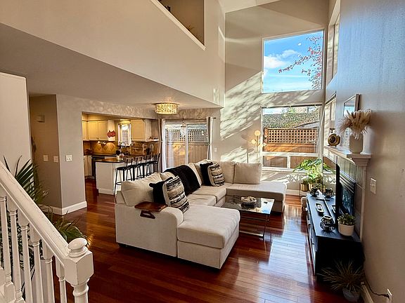 Ground Floor: Living Room, Hallway, Kitchen, Powder Bathroom + Laundry, Access to Garage