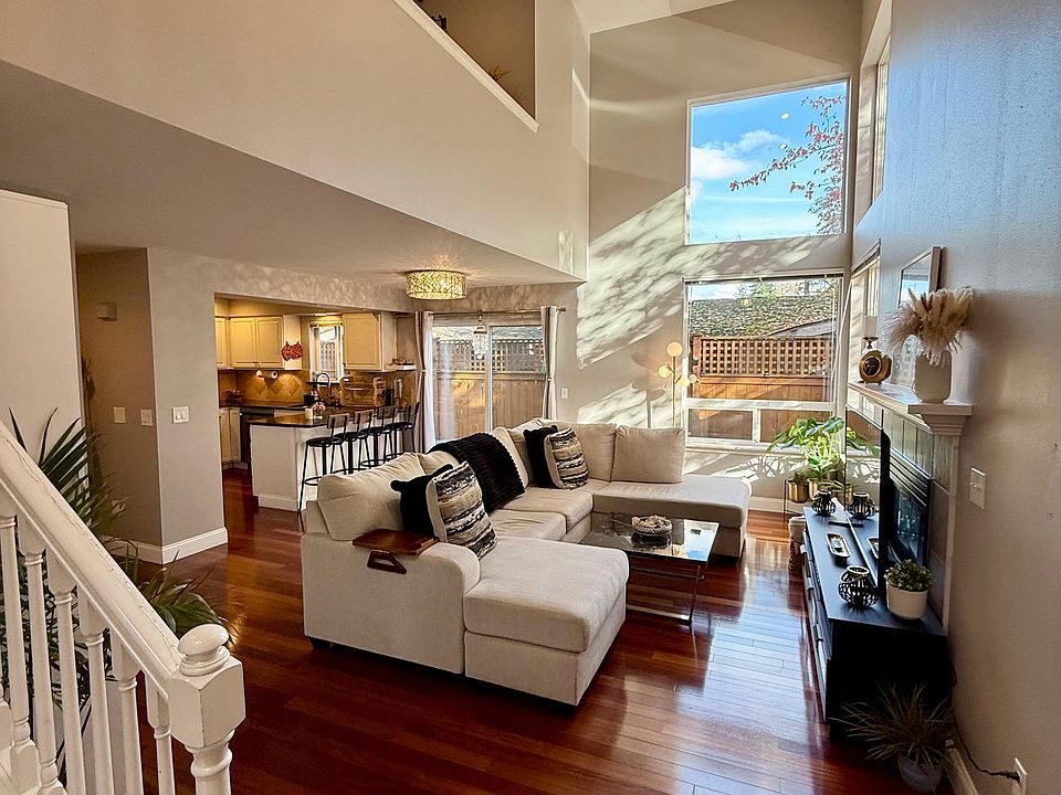 Ground Floor: Living Room, Hallway, Kitchen, Powder Bathroom + Laundry, Access to Garage