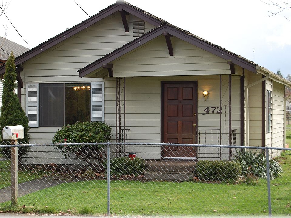 Front of home with covered porch.