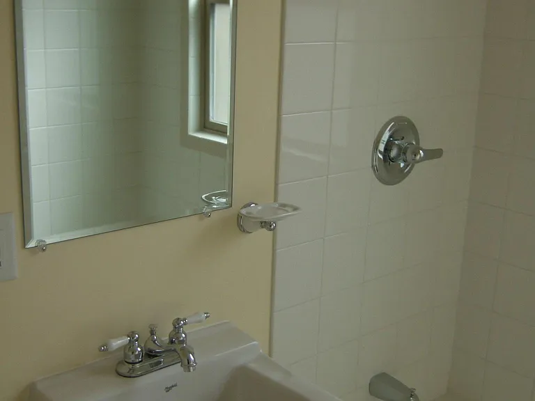 Fully tiled bath and shower surround, full size bath, plenty of water pressure.