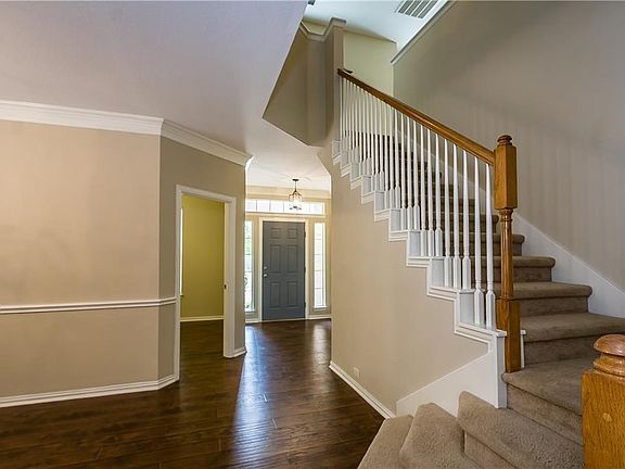 Front entry hall and stairway study entry and open formal dining