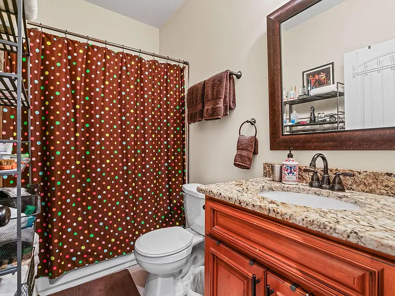 Connected to the primary bedroom, this en-suite features modern finishes and a clean, timeless design.