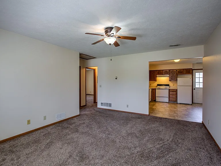 Living room and kitchen entrance in a unit at Gretna Oaks.