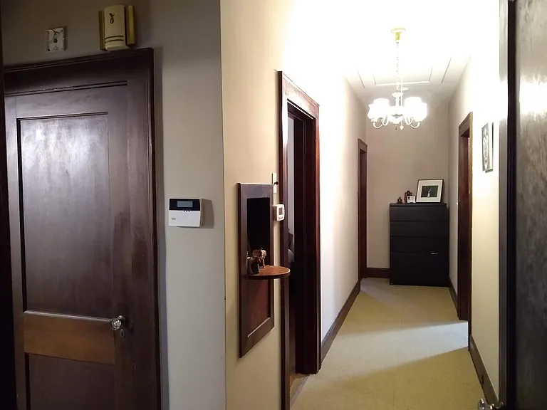 Hall way from living room to bedrooms, bath and kitchen