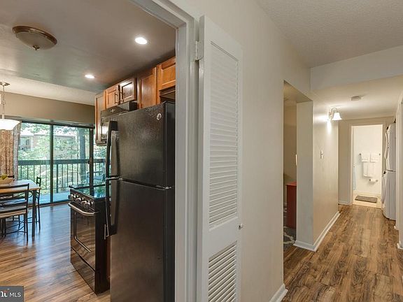 Hallway and view into kitchen