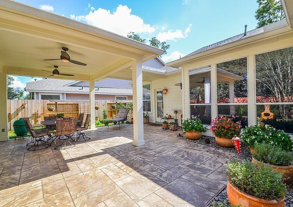 Outdoor living at it's finest! Custom built covered patio, stamped concrete and private yard with no back neighbors!