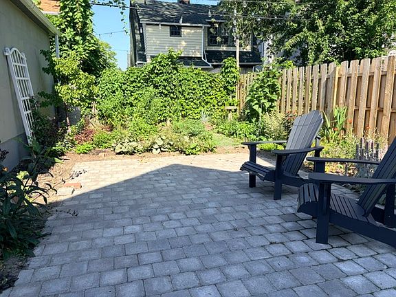 Fenced in backyard patio and garden