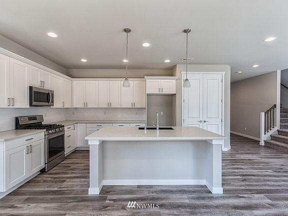 Photos are of the Huntington plan at Holley Brooke Lot 16, and may depict enhancements and/or upgrades that are not available with every plan.